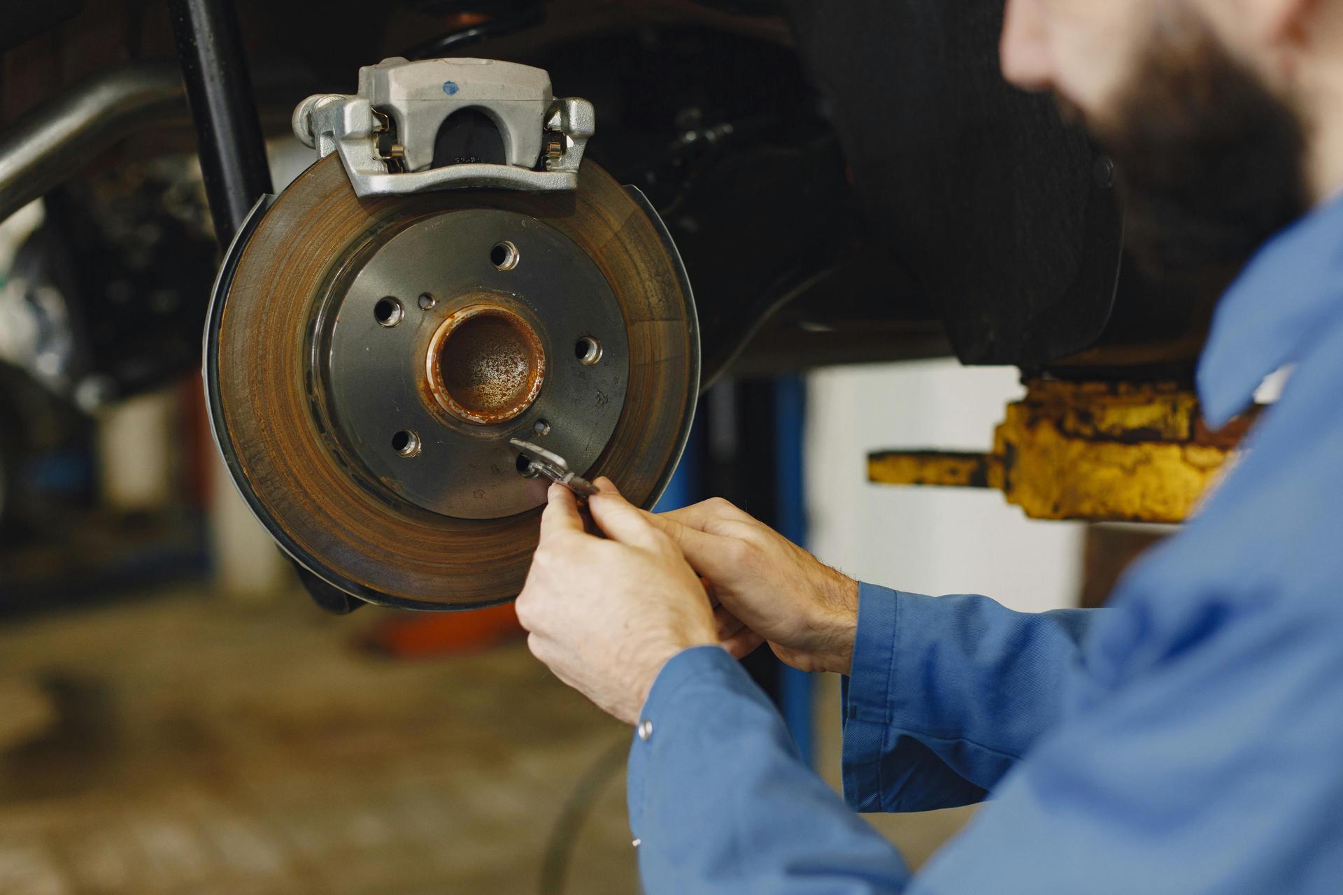 Engineer repairs braking system at Shurlock Row garage