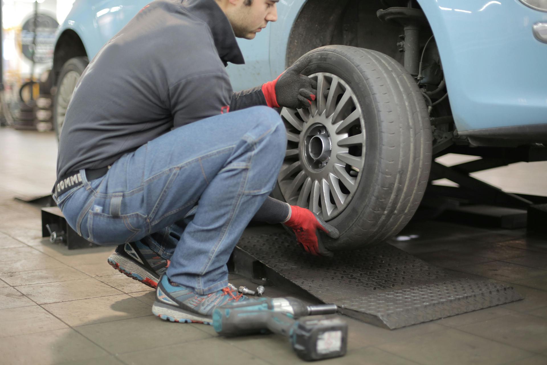 A car's tyres are being changed at Shurlock Row garage